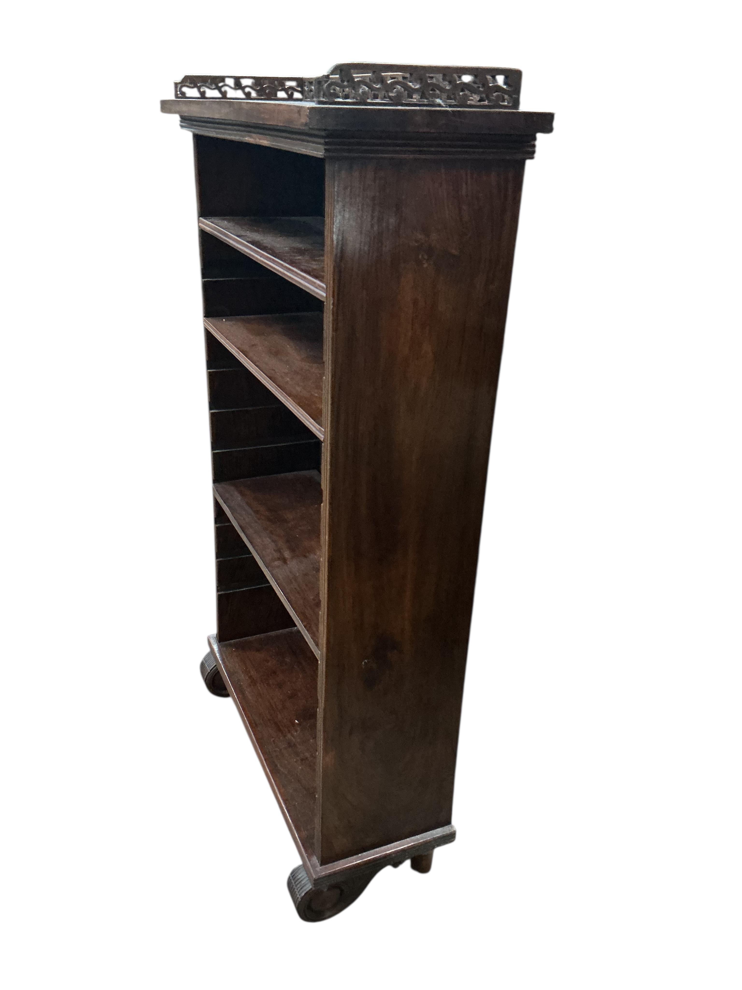 A small reproduction hardwood open bookcase, width 59cm, depth 22cm, height 100cm
